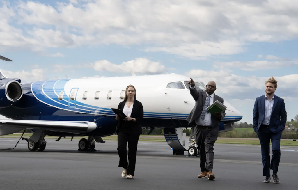 business professionals walking away from private jet on tarmac - article features quotes from Jennifer Pickerel of API talking about developing leaders as key retention strategy